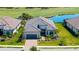 Beautiful single-story home featuring a well manicured lawn, landscaping and a two car garage at 3568 Santa Caterina Blvd, Bradenton, FL 34211