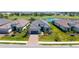 Charming single-story home showcasing lush landscaping, a paver driveway and a two-car garage at 3568 Santa Caterina Blvd, Bradenton, FL 34211