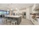 Modern kitchen with a large center island, pendant lights, stainless steel appliances, and an eat-in kitchen at 3568 Santa Caterina Blvd, Bradenton, FL 34211
