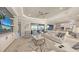 Spacious living room with an open floor plan featuring an oversized sectional sofa at 3568 Santa Caterina Blvd, Bradenton, FL 34211
