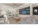 Stylish living area features a media wall and golf course views at 3568 Santa Caterina Blvd, Bradenton, FL 34211