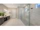 This main bathroom features dual sinks, white marbled tile, and a large shower at 3568 Santa Caterina Blvd, Bradenton, FL 34211
