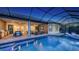 A gorgeous in-ground pool sits next to an outdoor seating area at 3568 Santa Caterina Blvd, Bradenton, FL 34211