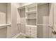 Spacious walk-in closet with built-in shelving and drawers for optimal organization at 3568 Santa Caterina Blvd, Bradenton, FL 34211