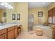 Well-lit bathroom featuring a separate tub, glass shower, and neutral color palette at 3752 Summerwind Cir, Bradenton, FL 34209