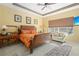 Spacious bedroom with a king-sized bed, comfortable seating, and bright, airy windows at 3752 Summerwind Cir, Bradenton, FL 34209