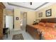 Spacious bedroom with a king-sized bed, bright windows, and an ensuite bathroom entrance at 3752 Summerwind Cir, Bradenton, FL 34209