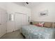 Cozy bedroom with queen-sized bed, soft bedding, and nautical decorations on the walls at 3752 Summerwind Cir, Bradenton, FL 34209