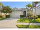 Charming single-story home features a well-maintained lawn, mature landscaping, and an attached two-car garage at 3752 Summerwind Cir, Bradenton, FL 34209