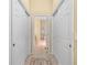 Hallway leading to bathroom with double closets on either side at 3752 Summerwind Cir, Bradenton, FL 34209