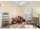 Inviting office space with natural light, a cozy armchair, and a functional desk setup at 3752 Summerwind Cir, Bradenton, FL 34209