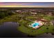 Community with pool, clubhouse, green space, tennis court, playground, and lake views at 3814 Scrub Creek Run, Lakewood Ranch, FL 34211