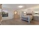 Bright bedroom features wood floors, a decorative dresser, and a comfortable bed with nightstands on either side at 3814 Scrub Creek Run, Lakewood Ranch, FL 34211