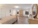 Inviting bedroom with wood floors, a comfortable bed, and an antique armoire with plenty of storage space at 3814 Scrub Creek Run, Lakewood Ranch, FL 34211