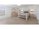 Spacious bedroom featuring neutral-toned decor, wood-look floors, and lots of light at 3814 Scrub Creek Run, Lakewood Ranch, FL 34211