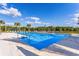 Community pool with chairs and clear blue skies at 3814 Scrub Creek Run, Lakewood Ranch, FL 34211