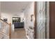 Welcoming foyer featuring tile flooring, decorative glass door, and a staircase leading to the upper level at 3814 Scrub Creek Run, Lakewood Ranch, FL 34211