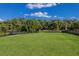 Community park includes a lawn and benches, creating a relaxing outdoor space for residents at 3814 Scrub Creek Run, Lakewood Ranch, FL 34211