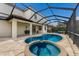Screened-in pool with an attached hot tub, and patio at 3814 Scrub Creek Run, Lakewood Ranch, FL 34211