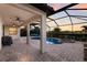 Relaxing screened-in lanai features a private pool and spa, ideal for outdoor entertaining with picturesque backyard views at 3814 Scrub Creek Run, Lakewood Ranch, FL 34211