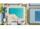 Aerial view featuring the tennis court and community pool with lounge chairs at 4001 Beneva Rd # 343, Sarasota, FL 34233