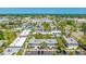 An aerial shot reveals a neighborhood with multi-story apartments and parking at 4001 Beneva Rd # 343, Sarasota, FL 34233