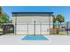 Outdoor community basketball court with hoops and a fenced-in playing area at 4001 Beneva Rd # 343, Sarasota, FL 34233