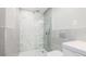 Modern bathroom featuring a walk-in shower with gray and white tile at 4001 Beneva Rd # 343, Sarasota, FL 34233