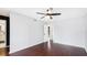 Spacious bedroom with hardwood floors, ceiling fan, and closet space at 4001 Beneva Rd # 343, Sarasota, FL 34233