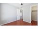 A bedroom featuring wood floors, light grey painted walls, ceiling fan, and closet at 4001 Beneva Rd # 343, Sarasota, FL 34233
