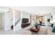 Bright and modern living room with tile floors, staircase and open layout leading to dining area at 4001 Beneva Rd # 343, Sarasota, FL 34233