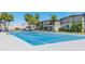 Outdoor tennis court with palm trees and landscaping adding to the appeal of this community at 4001 Beneva Rd # 343, Sarasota, FL 34233