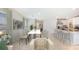 Inviting open-concept living space with dining area, kitchen, and comfortable seating at 4021 Direct Greeen Pl, Bradenton, FL 34208