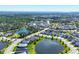 Aerial view of a Primary-planned community featuring single Gathering homes, ponds, and wooded areas at 4107 Pine Meadow Dr, Parrish, FL 34219