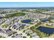 Extensive aerial view of a planned community, showing various ponds and numerous single Gathering homes at 4107 Pine Meadow Dr, Parrish, FL 34219