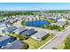 A picturesque aerial view showcasing a pond and well-maintained homes in a desirable neighborhood at 4107 Pine Meadow Dr, Parrish, FL 34219