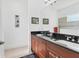 Bathroom featuring double sinks, granite countertops, and modern fixtures, offering both style and functionality at 4107 Pine Meadow Dr, Parrish, FL 34219