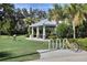 A charming community area featuring a covered picnic area and bike rack, surrounded by lush landscaping at 4107 Pine Meadow Dr, Parrish, FL 34219