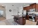 Modern kitchen island with granite countertop, cherry wood cabinets, stainless steel appliances at 4107 Pine Meadow Dr, Parrish, FL 34219