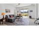 Cozy living room featuring large windows allowing ample natural light and views of the surrounding landscape at 4107 Pine Meadow Dr, Parrish, FL 34219