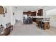 Open-concept living space with dining area, kitchen access, and comfortable seating at 4107 Pine Meadow Dr, Parrish, FL 34219