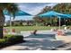 A vibrant community recreation field with colorful chairs and umbrellas, perfect for outdoor gatherings at 4107 Pine Meadow Dr, Parrish, FL 34219