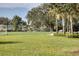 A recreation field featuring manicured grass, soccer nets, and benches, surrounded by lush trees at 4107 Pine Meadow Dr, Parrish, FL 34219