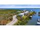 Waterfront homes with bay access and boat docks, surrounded by mature landscaping at 4109 Cobia Ct, Palmetto, FL 34221