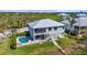 Stunning home with pool, luscious landscaping, and direct access to water, perfect for outdoor living at 4109 Cobia Ct, Palmetto, FL 34221