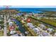 Neighborhood aerial view with waterfront homes, a canal, and a preserve in the distance at 4109 Cobia Ct, Palmetto, FL 34221