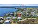 An aerial view of a waterfront home with canal access to the yacht club and bay at 4109 Cobia Ct, Palmetto, FL 34221