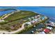 Scenic aerial view of waterfront homes, docks, open water, and mangroves at 4109 Cobia Ct, Palmetto, FL 34221