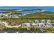 An aerial view of waterfront homes with boat docks, canals, and bay access at 4109 Cobia Ct, Palmetto, FL 34221