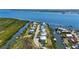 An aerial view of waterfront homes along a canal, offering convenient boat access to bay at 4109 Cobia Ct, Palmetto, FL 34221